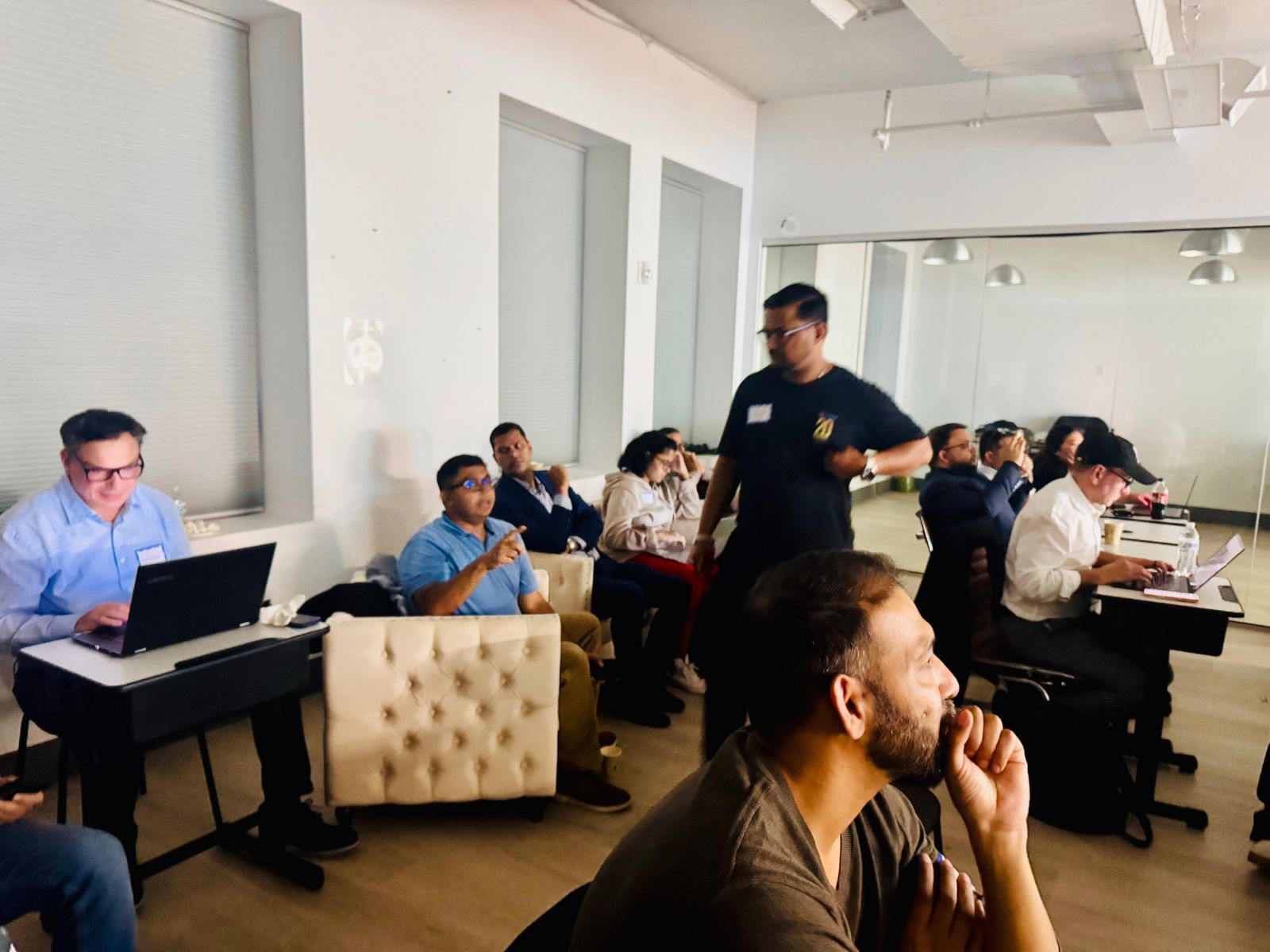 Business owners sitting side by side and learning in class